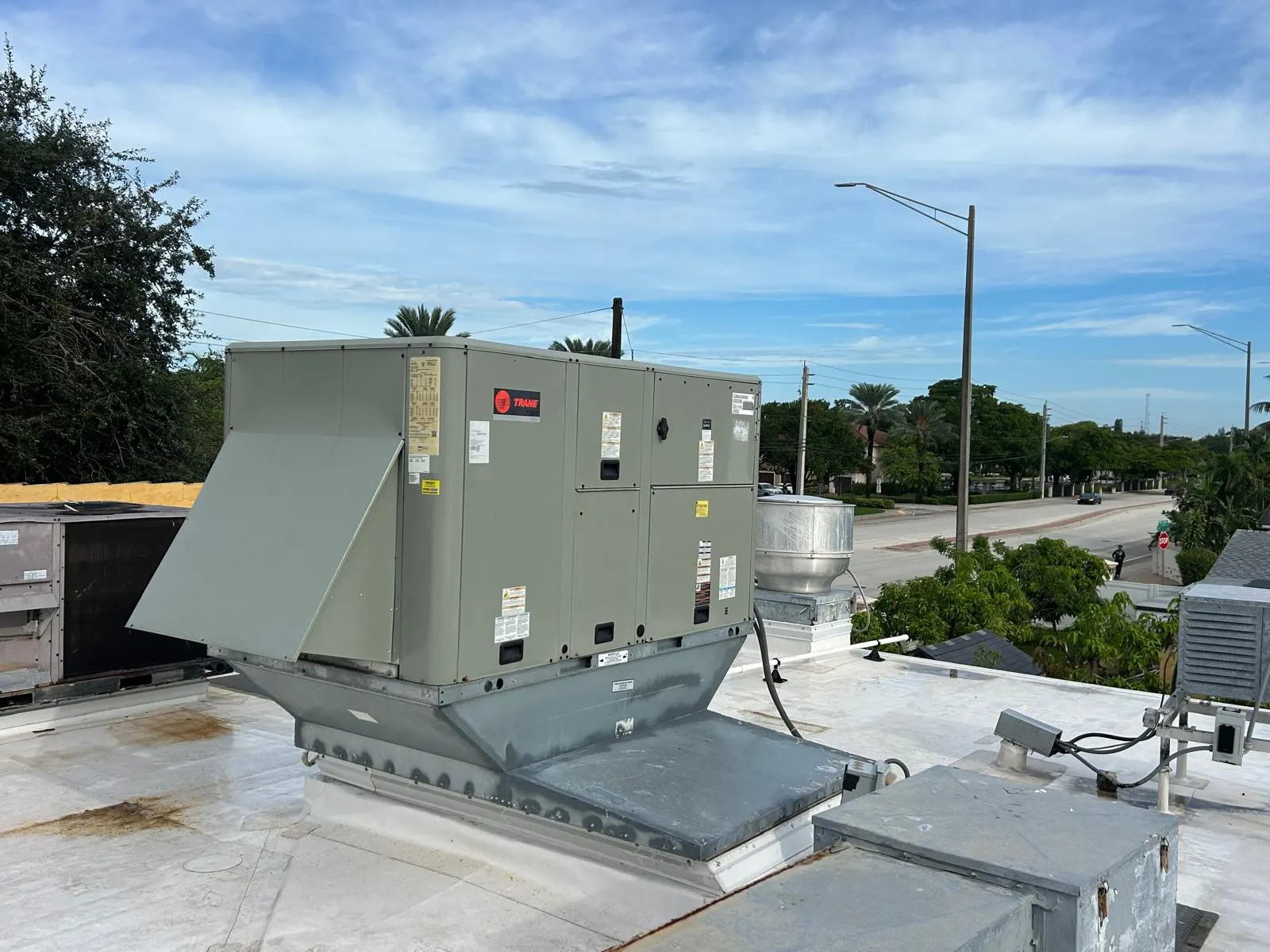 Completed Trane packaged rooftop unit with custom curb adapter at Milano’s Italian Grill